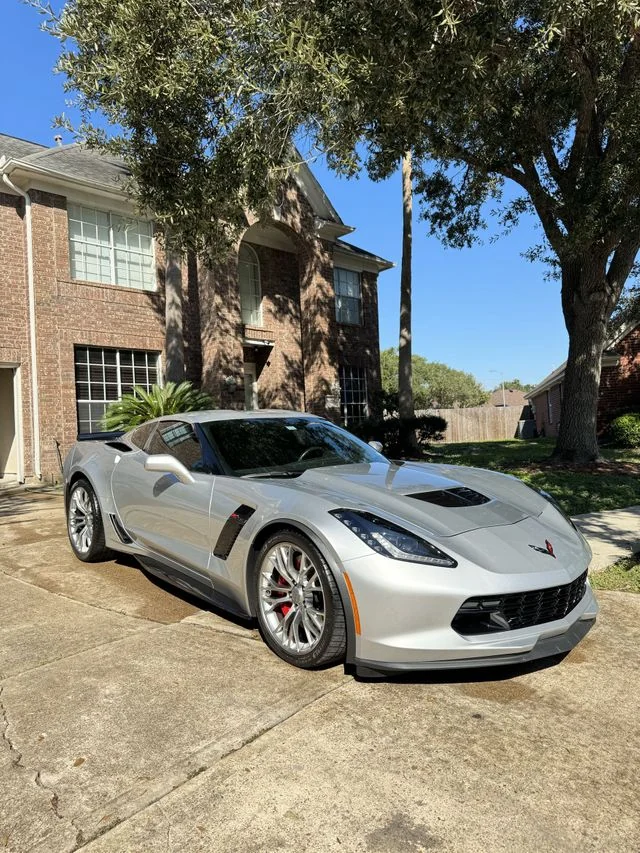 White Corvette in driveway